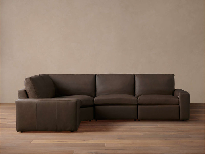 Kipton Wide Arm Leather Four-Piece Motion Sectional